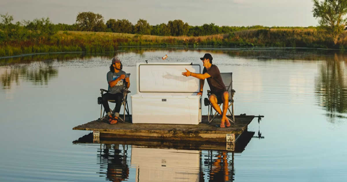 2 guys on a raft with a Yeti cooler